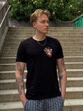 T-Shirt mit Herz-Print auf der Brust.